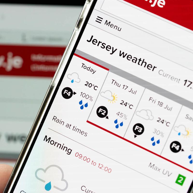 A closeup of a mobile phone showing the gov.je weather forecast
