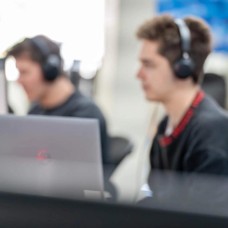A depth-of-field shot showing the IT Services team at work in the operations centre