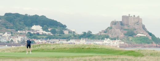A photo of the Royal Jersey Golf Course with Mont Orgueil Castle in the background