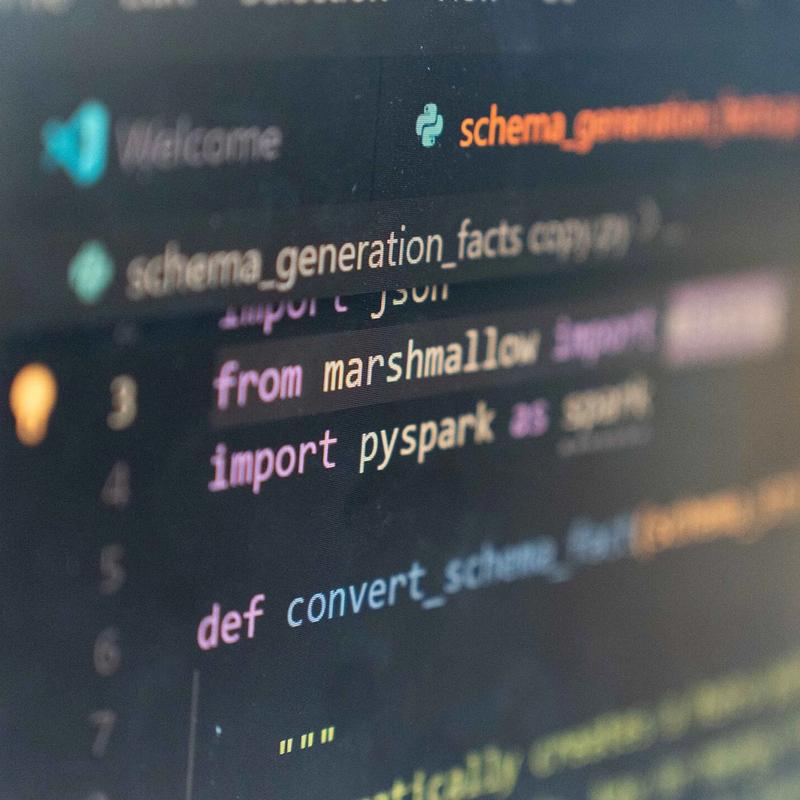 A close-up of a monitor displaying computer code