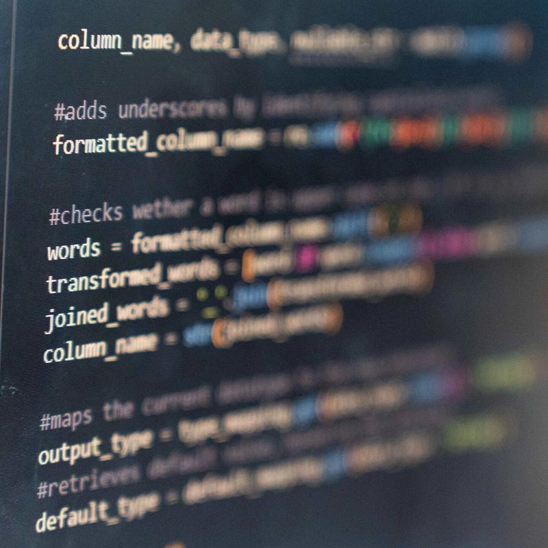 A close-up of a monitor displaying computer code