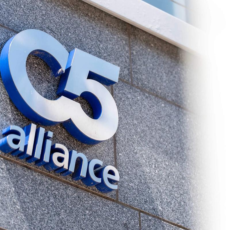 A photograph of a C5 Alliance logo on a building