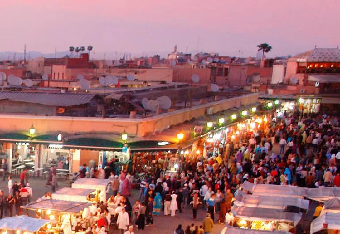 A market in a tropical country photographed from an upper storey of an adjacent building