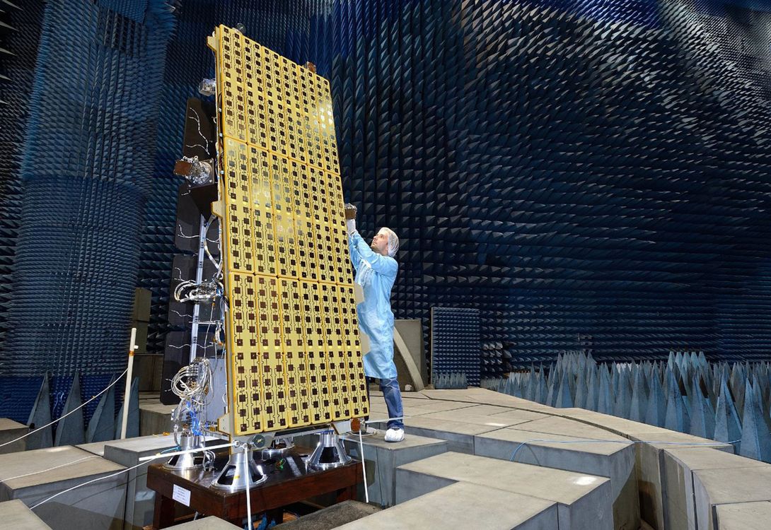 A photo showing a satellite being tested in a research centre