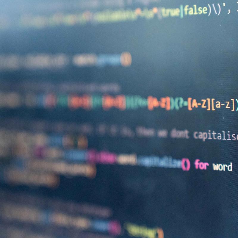 A close-up of a monitor displaying computer code